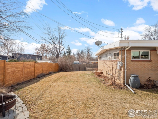 view of yard with a fenced backyard