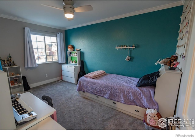 carpeted bedroom featuring crown molding, a ceiling fan, and baseboards