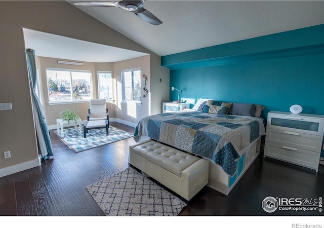 bedroom with lofted ceiling, baseboards, dark wood-style flooring, and ceiling fan