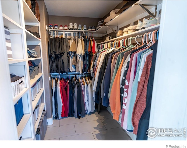 spacious closet with tile patterned flooring