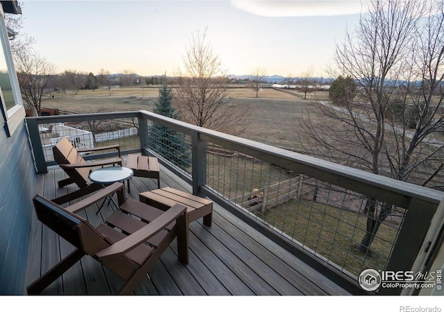 balcony at dusk with a rural view