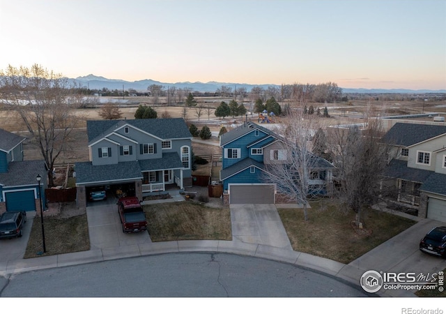 bird's eye view featuring a mountain view and a residential view