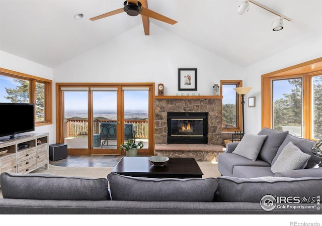 82 Grove Ct, Boulder, CO 80302 - living room with a fireplace, high vaulted ceiling, and a ceiling fan