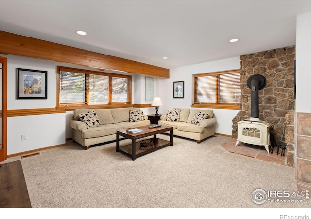 82 Grove Ct, Boulder, CO 80302 - living area with plenty of natural light, a wood stove, carpet floors, baseboards, and recessed lighting