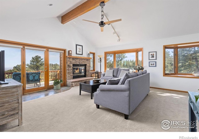 82 Grove Ct, Boulder, CO 80302 - carpeted living room with beamed ceiling, ceiling fan, a fireplace, baseboards, and high vaulted ceiling