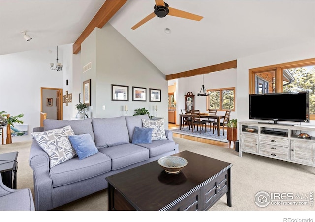 82 Grove Ct, Boulder, CO 80302 - living area with light colored carpet, high vaulted ceiling, beamed ceiling, a ceiling fan, and healthy amount of natural light