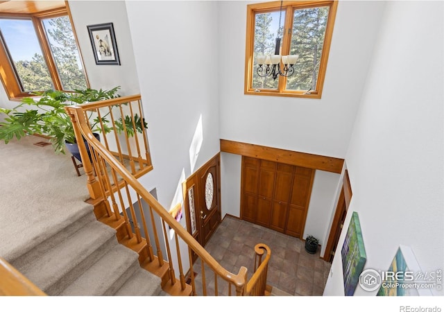 82 Grove Ct, Boulder, CO 80302 - foyer featuring a high ceiling, a chandelier, and stairway