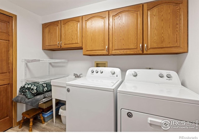 82 Grove Ct, Boulder, CO 80302 - laundry area with separate washer and dryer, cabinet space, and wood finished floors