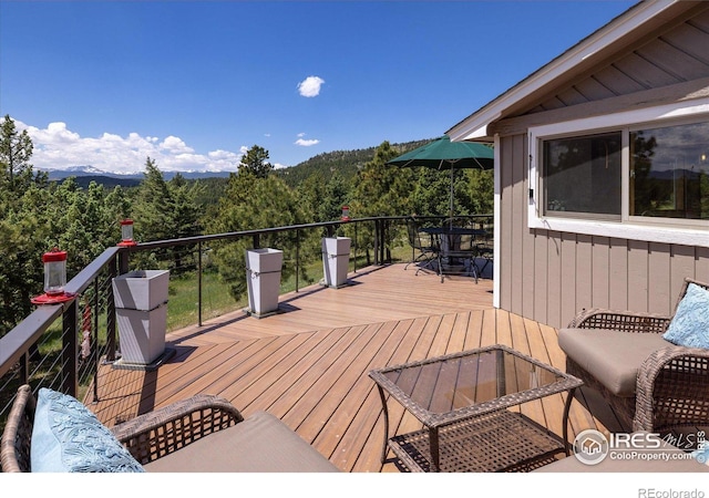 deck featuring a forest view