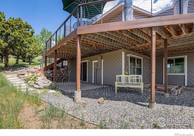 view of home's exterior with stairs and a patio area