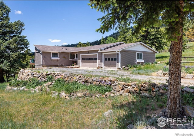 view of front of property with an attached garage and driveway