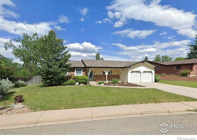 single story home with a front lawn, concrete driveway, an attached garage, and fence