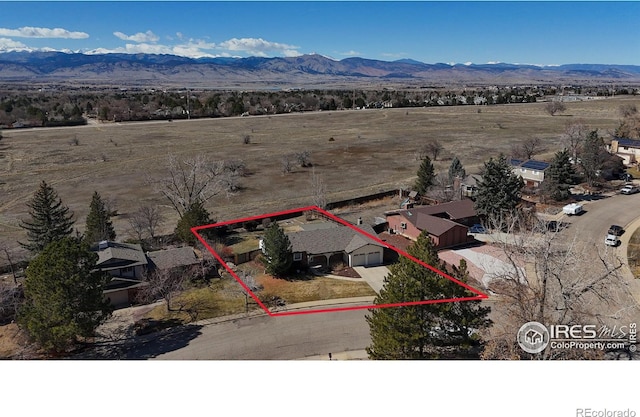 drone / aerial view featuring a mountain view and a rural view