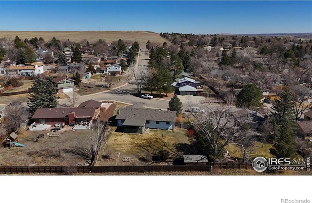 birds eye view of property with a residential view