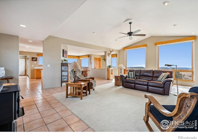 living room with lofted ceiling, light tile patterned floors, recessed lighting, and light carpet