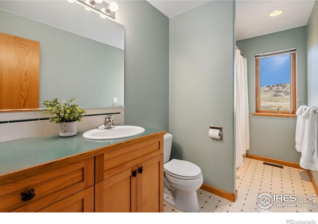 full bathroom featuring tile patterned floors, visible vents, toilet, baseboards, and vanity