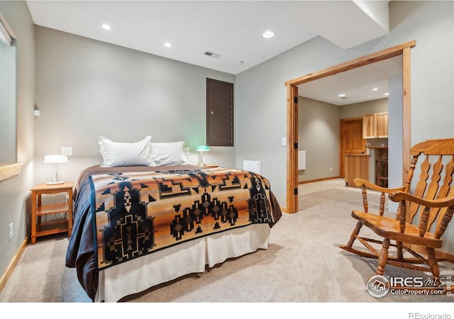 bedroom featuring baseboards, recessed lighting, visible vents, and light carpet