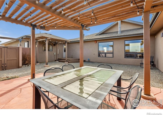 view of patio / terrace with outdoor dining space, a pergola, and fence