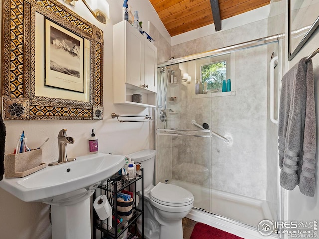 full bathroom with a shower stall, toilet, wooden ceiling, and beam ceiling