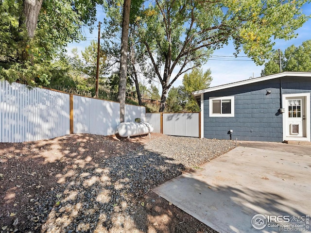 view of yard featuring a patio and fence