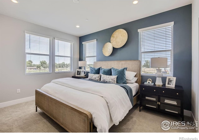 bedroom with recessed lighting, baseboards, and carpet flooring