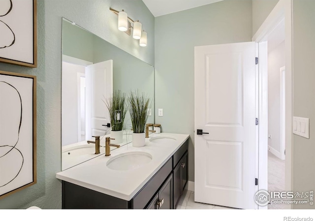 bathroom with double vanity and a sink