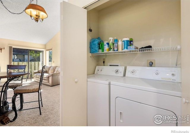 laundry area with separate washer and dryer, laundry area, and carpet