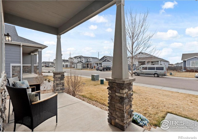 view of patio / terrace with covered porch and a residential view