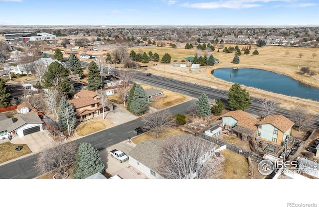 birds eye view of property featuring a residential view and a water view