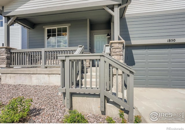 view of exterior entry with covered porch