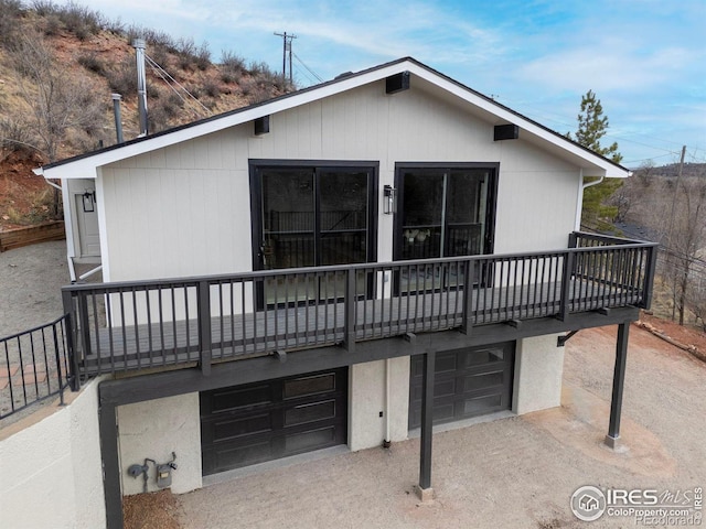 back of property featuring a garage