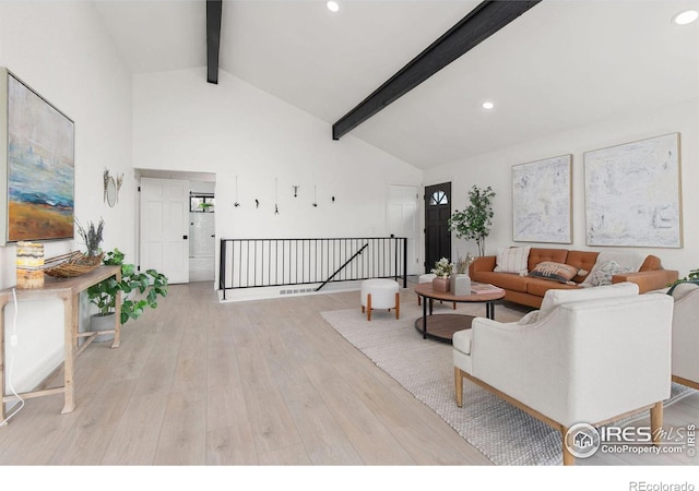 living area with beam ceiling, recessed lighting, wood finished floors, and high vaulted ceiling