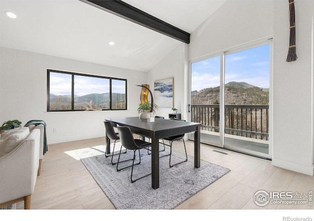 dining room with visible vents, wood finished floors, recessed lighting, baseboards, and vaulted ceiling with beams