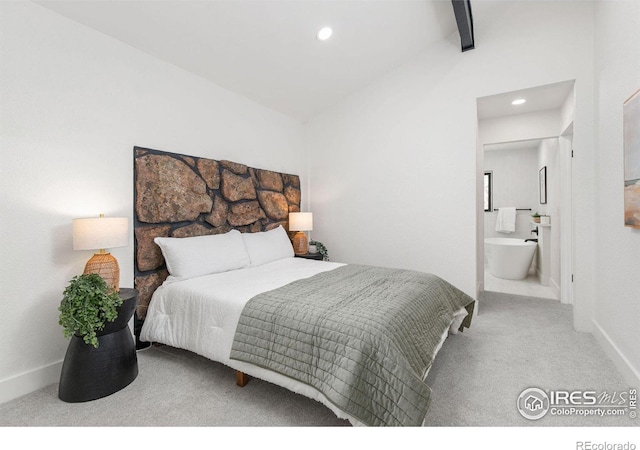 carpeted bedroom with ensuite bath, recessed lighting, vaulted ceiling with beams, and baseboards