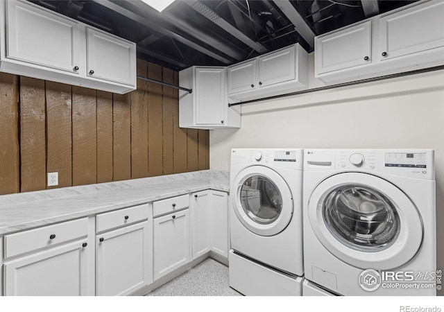 laundry room featuring washer and dryer and cabinet space