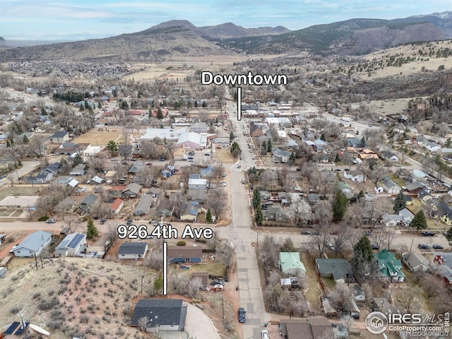 birds eye view of property with a residential view and a mountain view