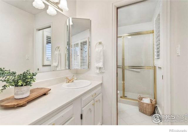 full bathroom with vanity and a stall shower