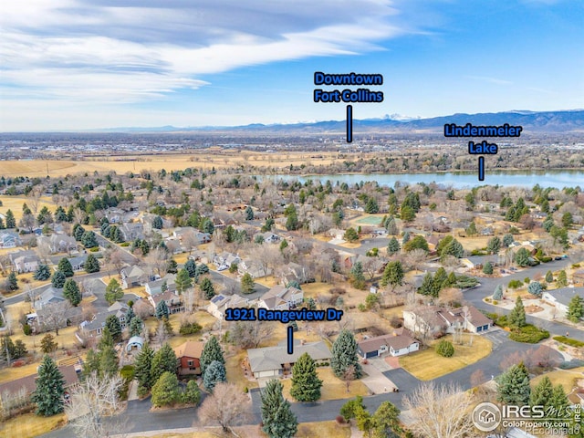 bird's eye view with a residential view and a water and mountain view