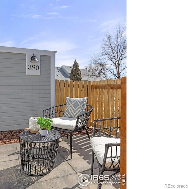 view of patio / terrace featuring fence