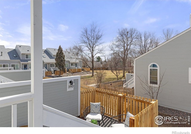 deck featuring a residential view and fence