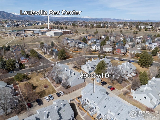 birds eye view of property with a residential view and a mountain view