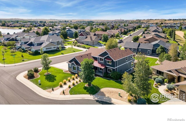 aerial view with a residential view and a water view