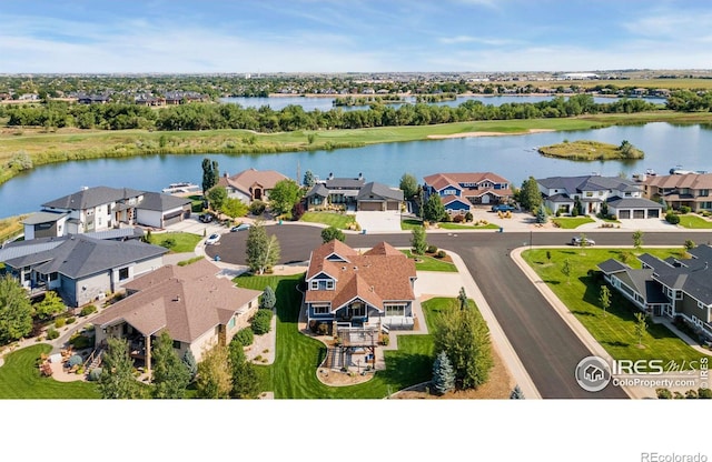 aerial view featuring a residential view and a water view