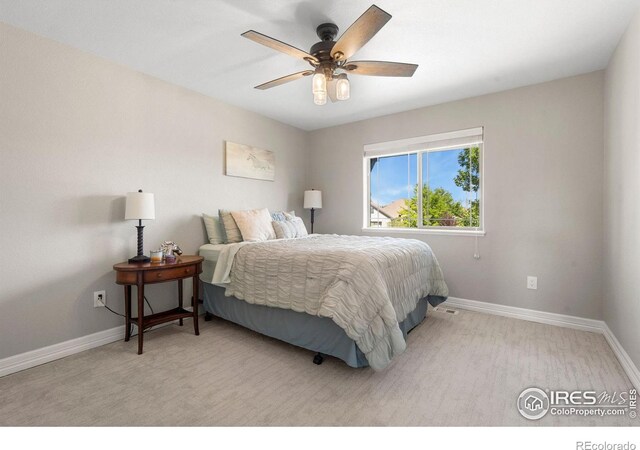 bedroom with ceiling fan and baseboards