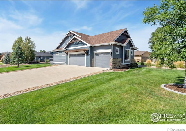 craftsman house featuring an attached garage, concrete driveway, and a front yard