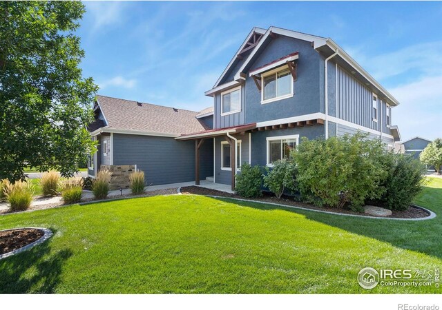 view of front of home with a front yard