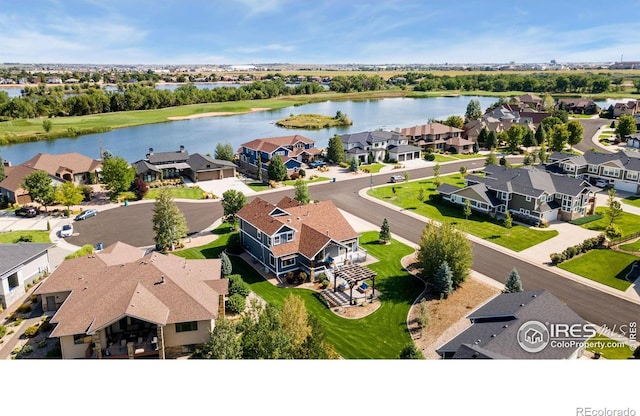 aerial view featuring a residential view and a water view