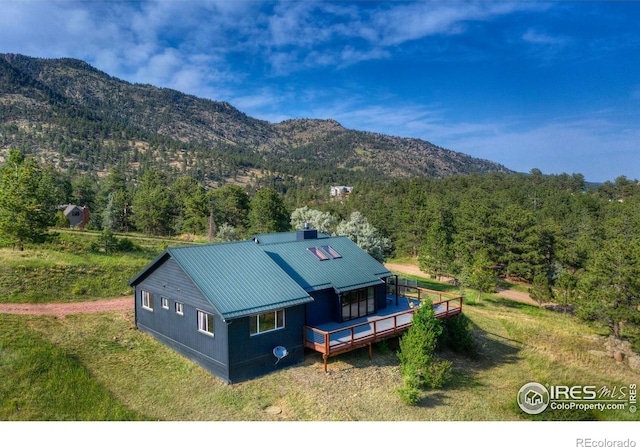 bird's eye view with a wooded view and a mountain view