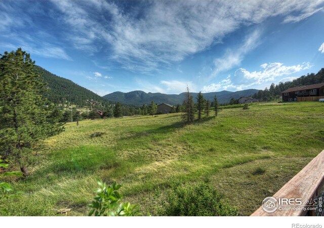 view of mountain feature with a rural view