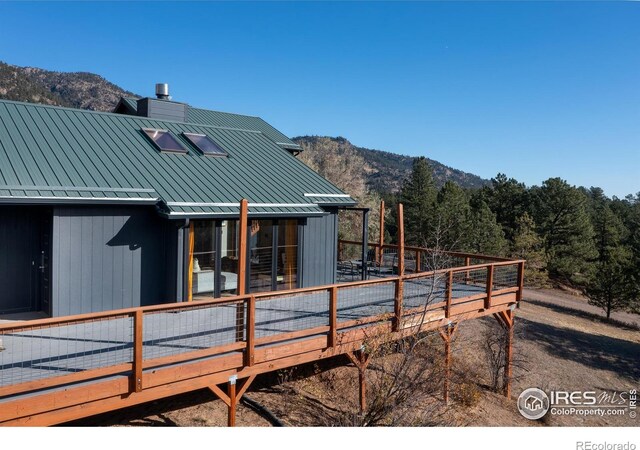 exterior space featuring a deck with mountain view